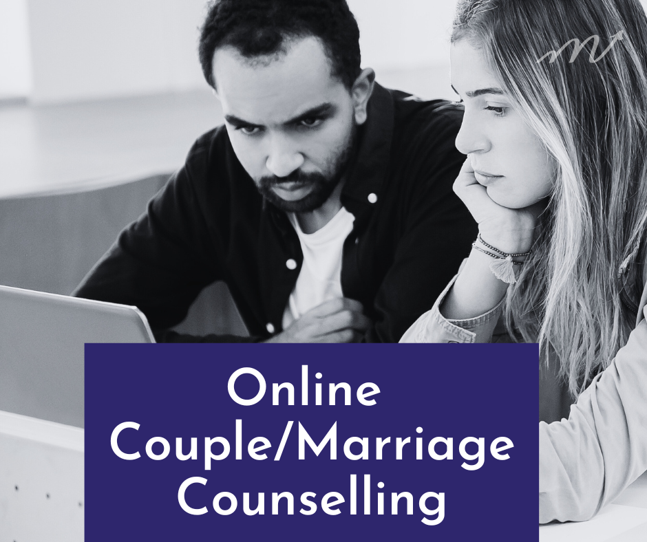 A couple sitting together in front of a computer for online couple or marriage counselling