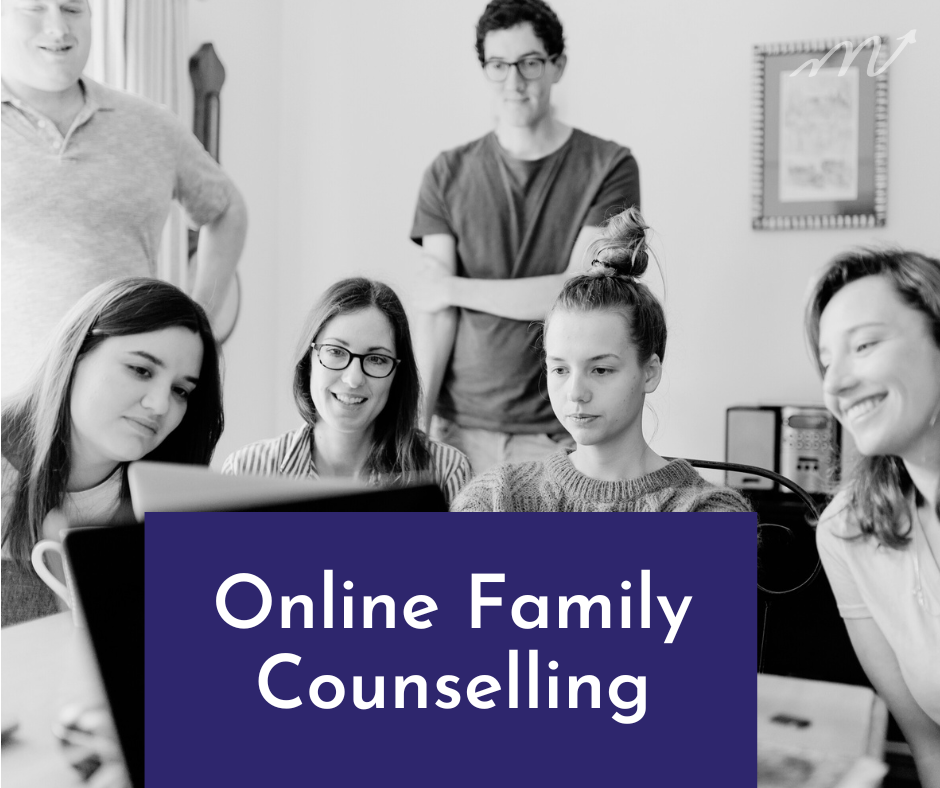 A family in front of a computer together for online family counselling